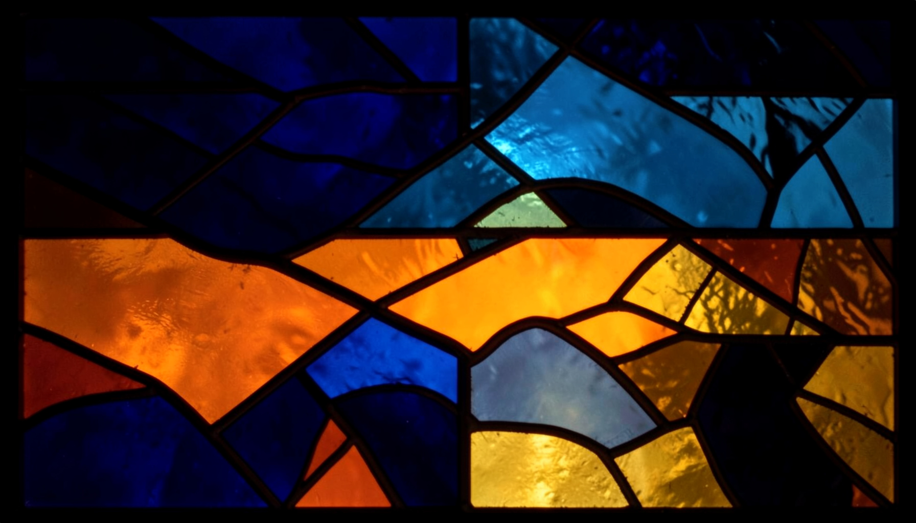 A stained-glass composition with bold leaded segments in deep navy, ice blue, and warm gold, suggesting stealth and nighttime adventure