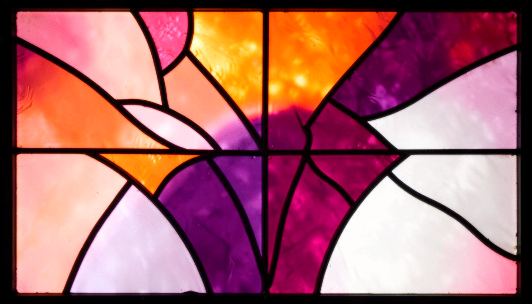 A stained-glass composition with bold leaded segments in rose pink, plum purple, and pearl white, suggesting beauty and glamour